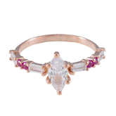 Sophia modern red gemstone ring with a marquise clear center stone and small red and white side stones
